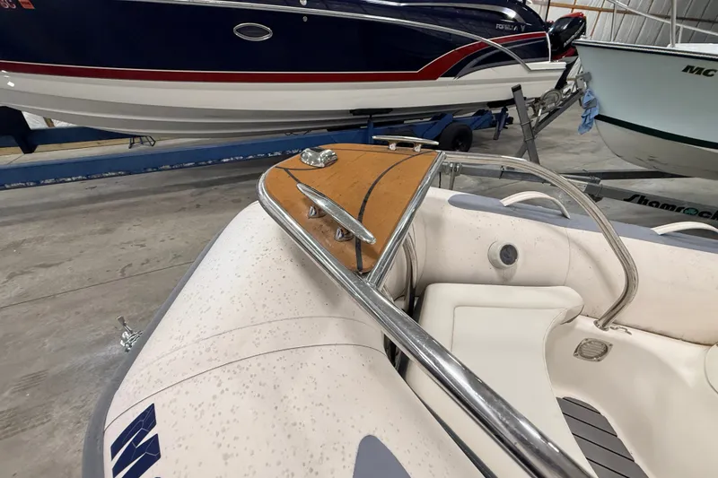Slide: The Image of 2013 Zodiac Yachtline 2 Deluxe 340 inflatable boat interior with seating and railing. - 4