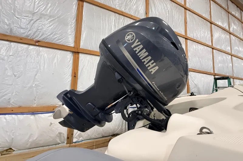 Slide: The Image of Yamaha outboard motor on 2013 Zodiac Yachtline 2 Deluxe 340 in storage facility. - 8