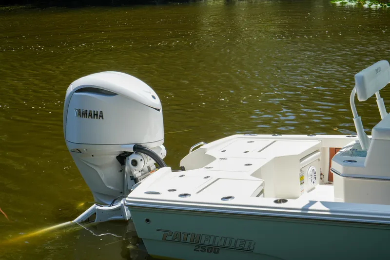 Slide: The Image of 2026 Pathfinder 2500 Tournament boat with Yamaha outboard engine on calm water. - 9