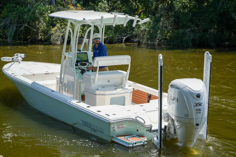 Slide: The Image of 2026 Pathfinder 2500 Tournament boat with Yamaha 350 V6 engine on a calm river. - 20