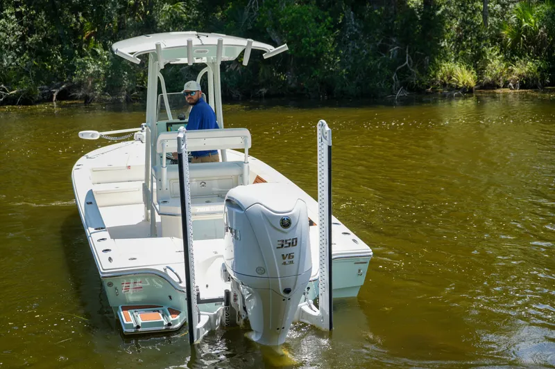Slide: The Image of Pathfinder 2500 Tournament 2026 boat navigating a calm river with lush greenery. - 21