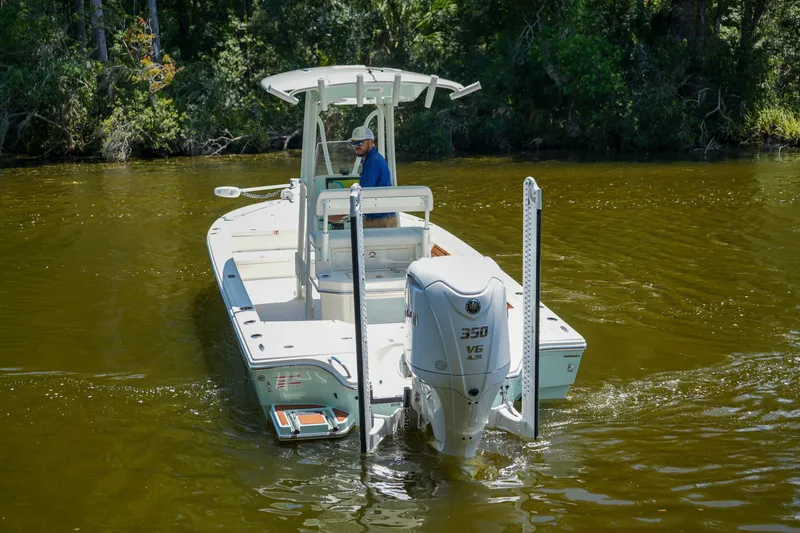 Slide: The Image of 2026 Pathfinder 2500 Tournament boat navigating a calm river, surrounded by lush greenery. - 16