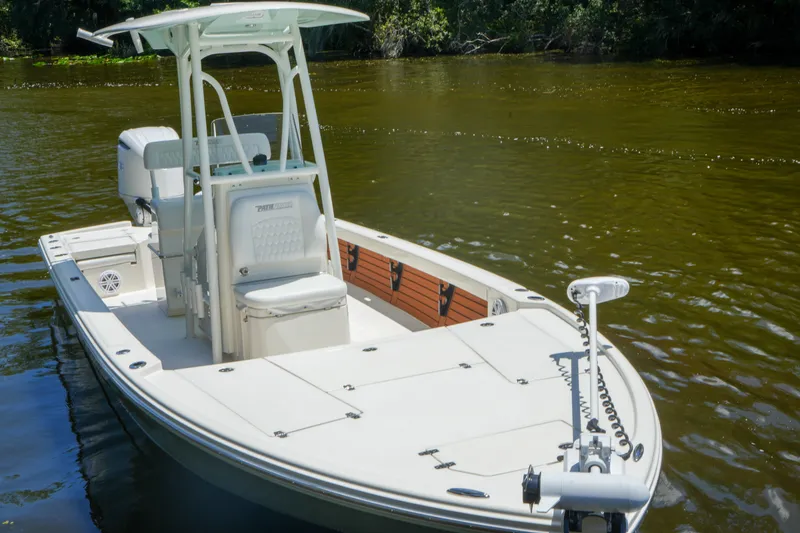Slide: The Image of 2026 Pathfinder 2500 Tournament boat on calm river water, featuring sleek design and modern amenities. - 3