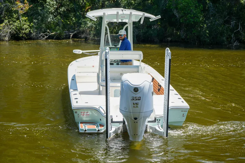 Slide: The Image of 2026 Pathfinder 2500 Tournament boat navigating through calm waters. - 13