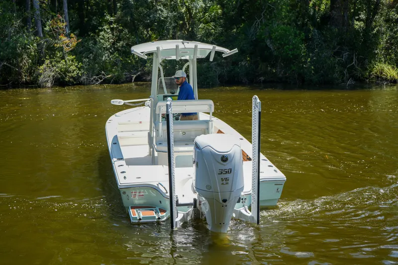 Slide: The Image of 2026 Pathfinder 2500 Tournament boat navigating a calm river with lush forest backdrop. - 15