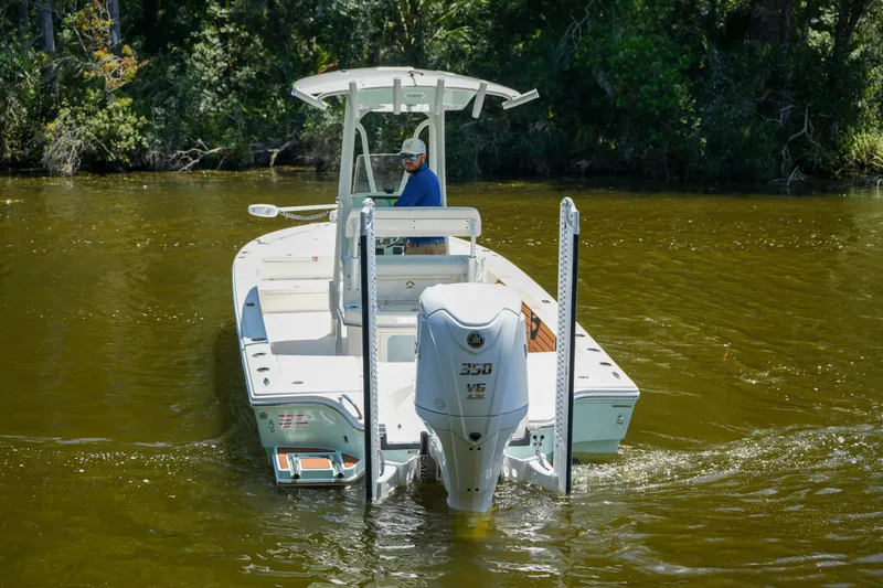 Slide: The Image of 2026 Pathfinder 2500 Tournament boat navigating through calm waters. - 14