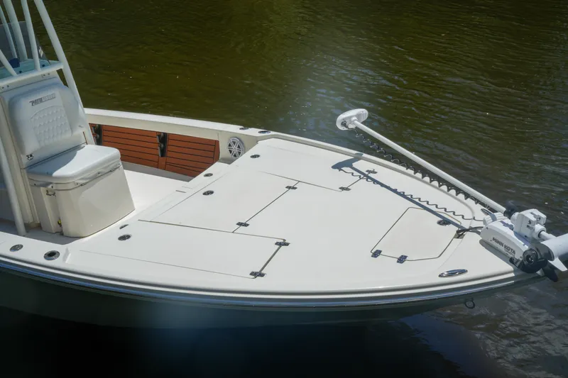 Slide: The Image of 2026 Pathfinder 2500 Tournament boat with spacious deck and trolling motor on calm water. - 1