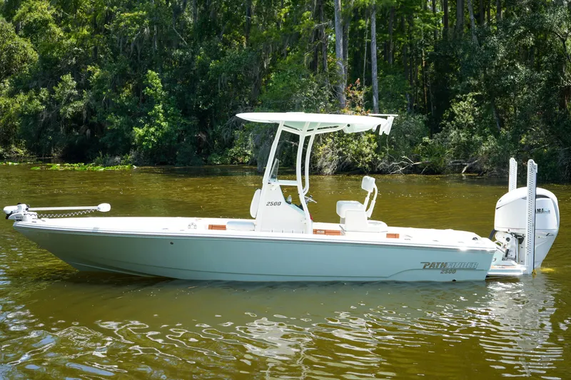 The Image of 2026 Pathfinder 2500 Tournament boat on a calm river, surrounded by lush greenery. - 0