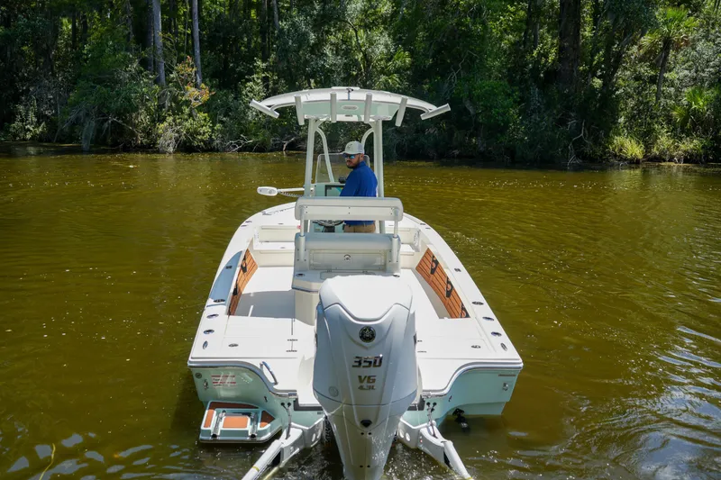 Slide: The Image of 2026 Pathfinder 2500 Tournament boat navigating a forested river. - 28