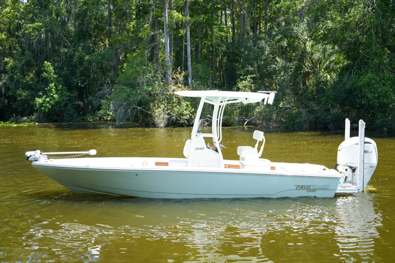 Slide: The Image of 2026 Pathfinder 2500 Tournament boat on calm water, surrounded by lush greenery. - 30