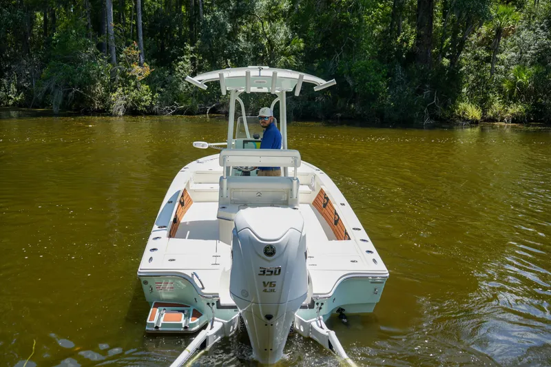 Slide: The Image of 2026 Pathfinder 2500 Tournament boat navigating a calm river, surrounded by lush greenery. - 27