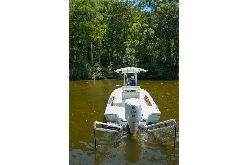 Slide: The Image of 2026 Pathfinder 2500 Tournament boat navigating a calm river, surrounded by lush greenery. - 25