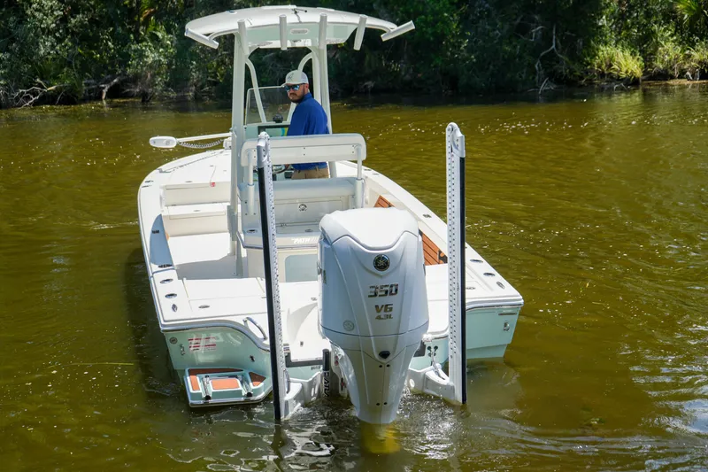 Slide: The Image of 2026 Pathfinder 2500 Tournament boat with powerful V6 engine on a calm river. - 23