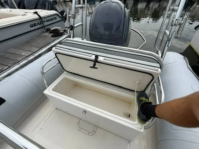 Slide: The Image of A 2022 Ribcraft 6.5 with an open storage compartment in the rear area. - 10