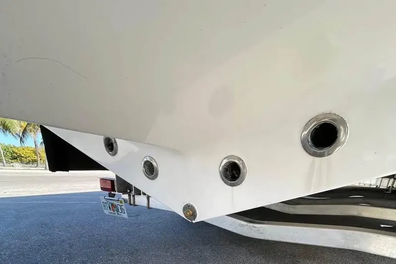 Slide: The Image of 2009 Midnight Express 34 Open boat hull with visible drain holes. - 7