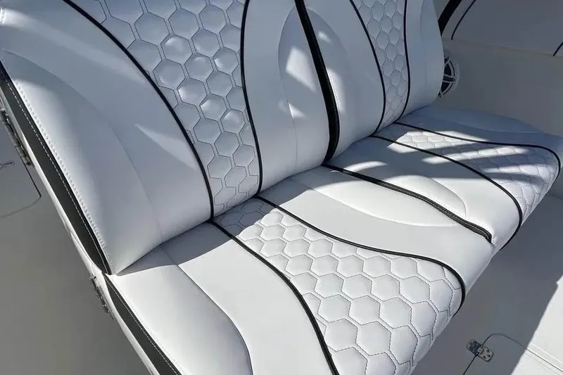 Slide: The Image of Luxurious white seating with hexagonal pattern on 2009 Midnight Express 34 Open boat. - 17