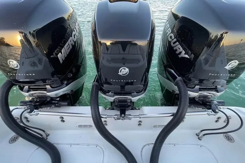 Slide: The Image of Triple Mercury outboard engines on a 2009 Midnight Express 34 Open boat. - 15