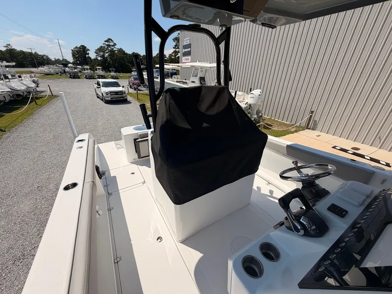 Slide: The Image of The image shows the cockpit of a 2027 Savannah 2900 Offshore boat with modern controls. - 13
