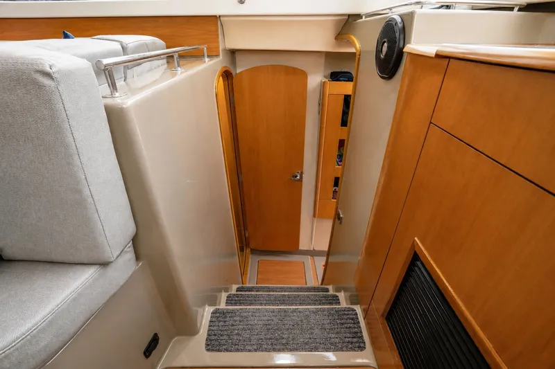 Slide: The Image of Interior of 2006 Fountaine Pajot Highland 35 Pilot yacht, featuring wooden finishes and stairs. - 22
