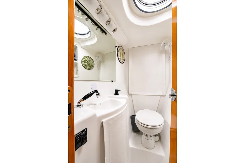 Slide: The Image of Compact bathroom in 2006 Fountaine Pajot Highland 35 Pilot yacht, featuring toilet and sink. - 28