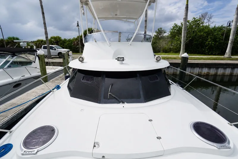 Slide: The Image of 2006 Fountaine Pajot Highland 35 Pilot yacht docked at marina, front view. - 9