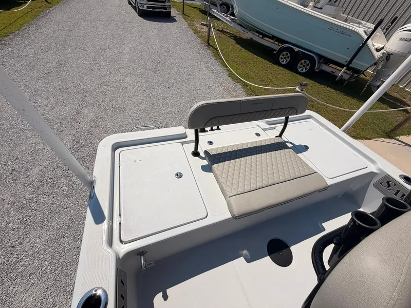 Slide: The Image of The image shows the stern of a 2027 Savannah 220 IS boat with a cushioned bench seat. - 15