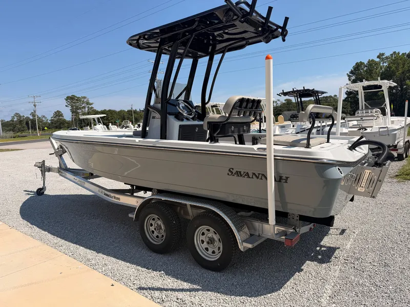 Slide: The Image of The image shows a gray 2027 Savannah 220 IS boat on a trailer. - 3
