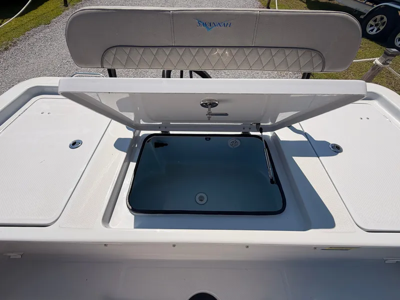 Slide: The Image of The image shows the open storage compartment of a 2027 Savannah 220 IS boat. - 14