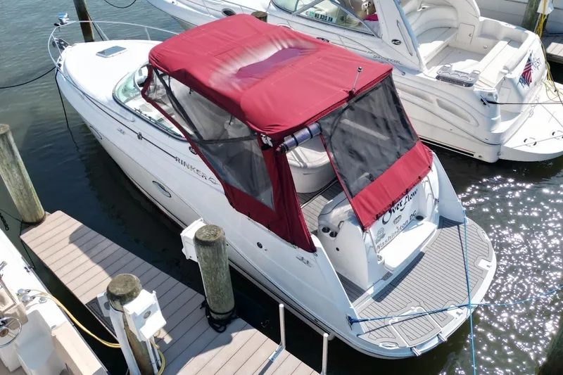 Slide: The Image of 2008 Rinker 280 Express Cruiser docked with red canopy, aerial view. - 4