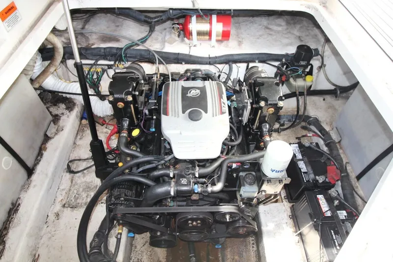 Slide: The Image of Engine compartment of a 2008 Rinker 280 Express Cruiser, showcasing detailed mechanical components. - 21