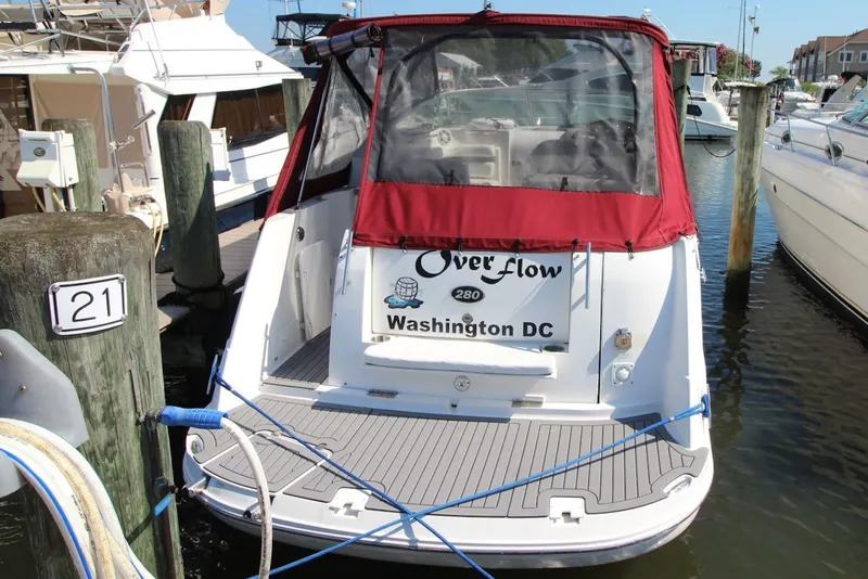 Slide: The Image of 2008 Rinker 280 Express Cruiser docked in marina, Washington DC. - 2