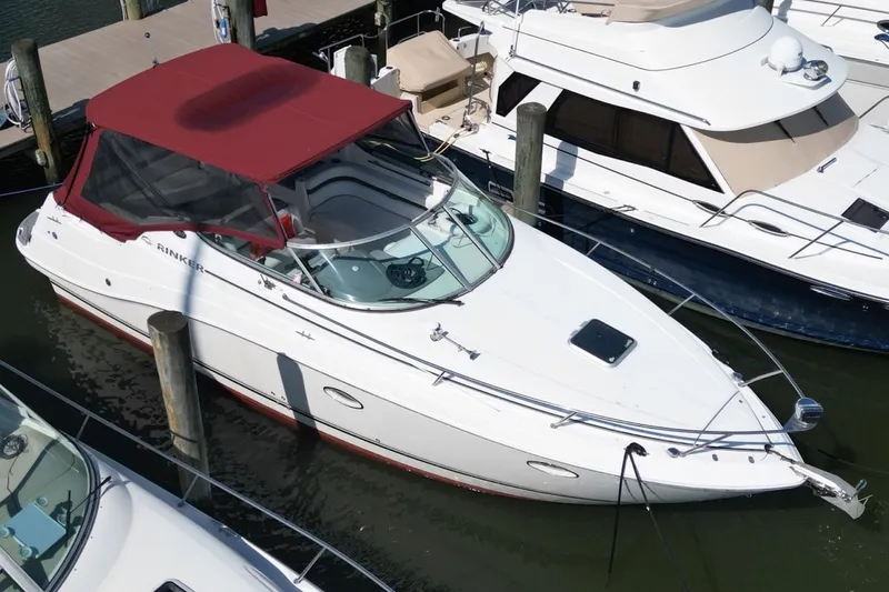 Slide: The Image of 2008 Rinker 280 Express Cruiser docked with red canopy, aerial view. - 6