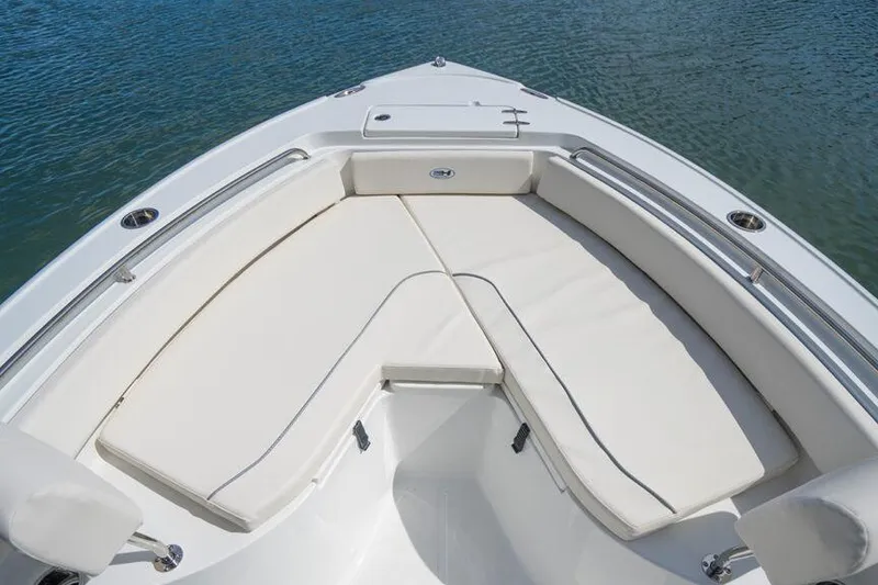 The Image of Manufacturer Provided Image: 2026 Sea Hunt Ultra 234 boat with cushioned seating on calm water. - 3