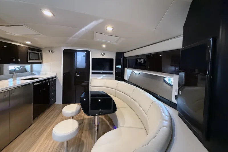 Slide: The Image of Luxurious interior of a 2016 Formula 40 Performance Cruiser with modern kitchen and seating area. - 16