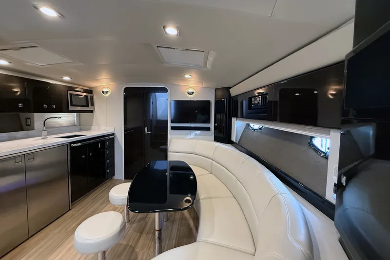 Slide: The Image of Luxurious interior of a 2016 Formula 40 Performance Cruiser with modern kitchen and seating area. - 19