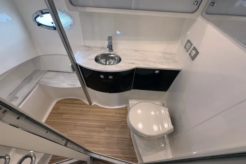 Slide: The Image of Luxurious bathroom in 2016 Formula 40 Performance Cruiser with modern fixtures and wood flooring. - 29