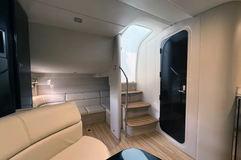 Slide: The Image of Interior of a 2016 Formula 40 Performance Cruiser, featuring modern seating and wooden steps. - 25