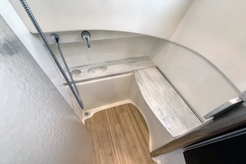 Slide: The Image of Shower area in 2016 Formula 40 Performance Cruiser with modern fixtures and wooden flooring. - 30