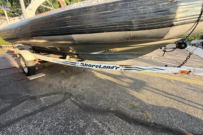 Slide: The Image of 2014 Zodiac Milpro SR 4.70 boat on ShoreLand'r trailer in parking lot. - 16