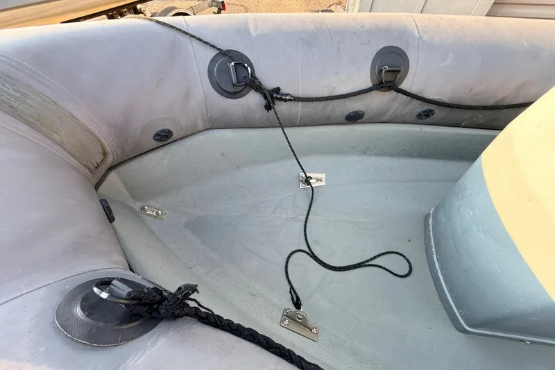 Slide: The Image of Interior view of a 2014 Zodiac Milpro SR 4.70 inflatable boat with ropes and fittings. - 25