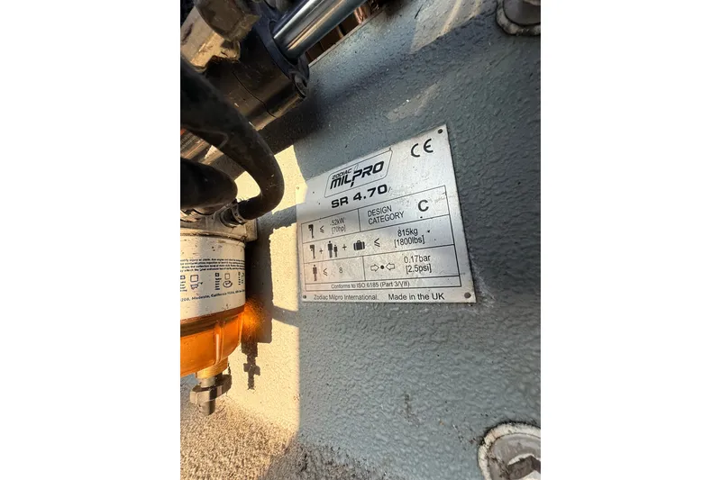 Slide: The Image of Zodiac Milpro SR 4.70 identification plate, 2014 model, showing specifications and design category. - 21