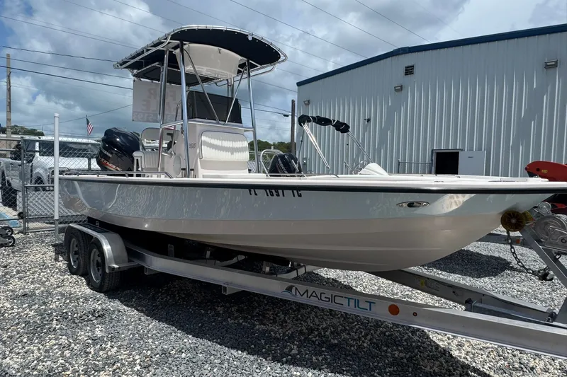 Slide: The Image of 2003 Pathfinder 2200 V boat on Magic Tilt trailer, parked outdoors. - 1