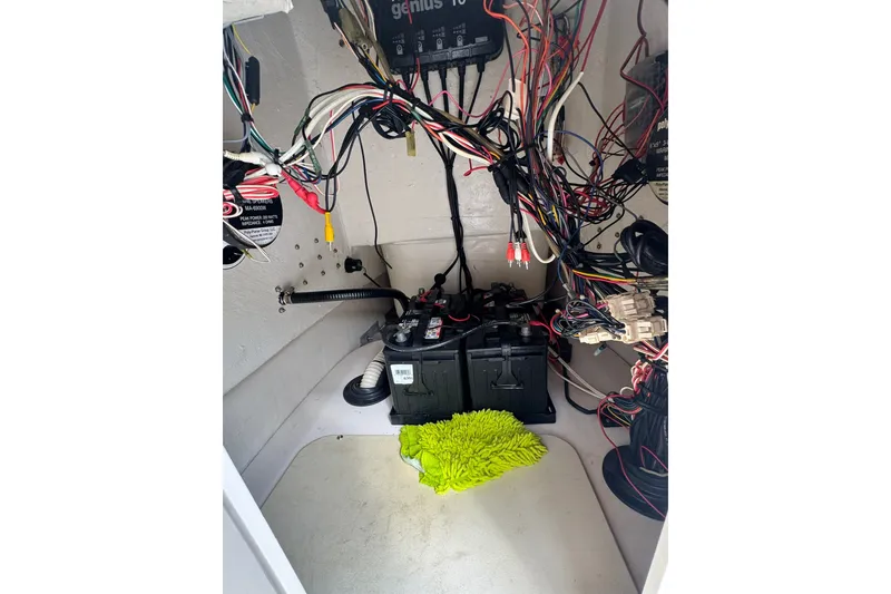 Slide: The Image of Interior view of a 2003 Pathfinder 2200 V boat showing wiring and battery setup. - 5