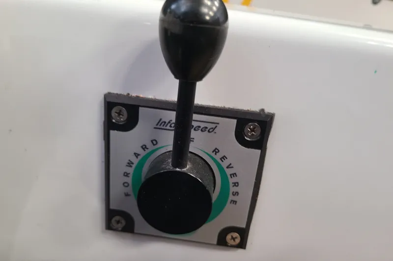 Slide: The Image of Throttle control lever on a 2019 Duffy 18 boat, showing forward and reverse settings. - 13
