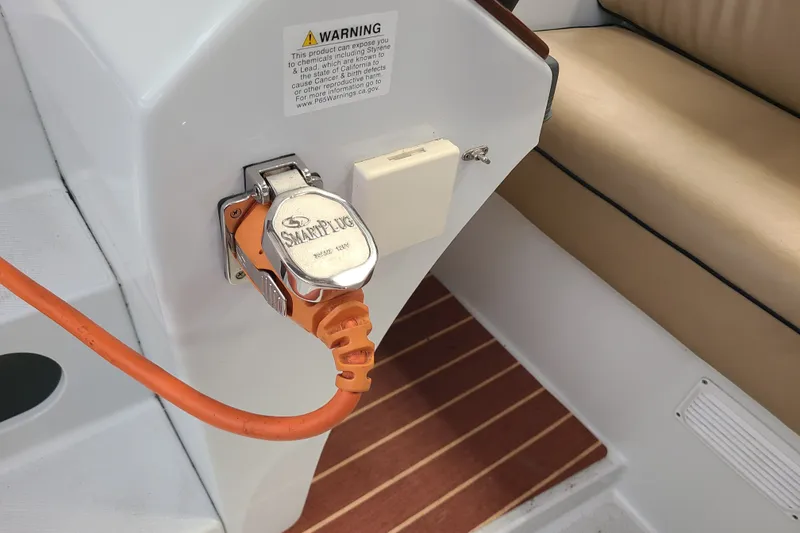 Slide: The Image of Electric plug connection on a 2019 Duffy 18 boat with SmartPlug system. - 18