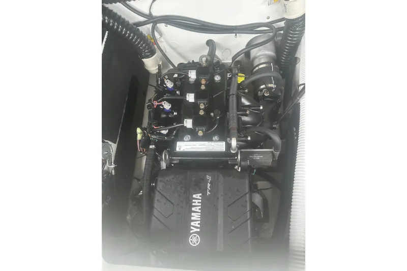 Slide: The Image of Engine compartment of 2025 Yamaha Boats AR220, showcasing TR-1 engine components. - 18