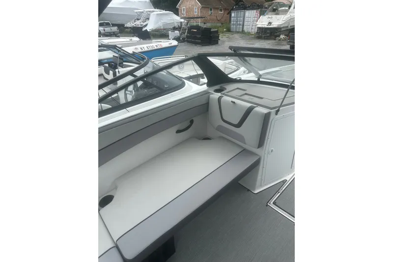 Slide: The Image of 2025 Yamaha Boats AR220 interior with sleek seating and modern design. - 15