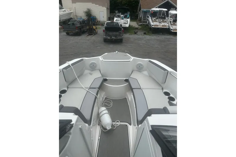 Slide: The Image of 2025 Yamaha Boats AR220 interior with spacious seating and modern design. - 8