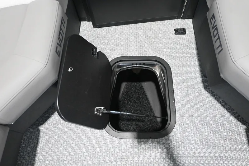 Slide: The Image of The 2026 Evotti 723QL features an open floor storage compartment with gray carpeting. - 18