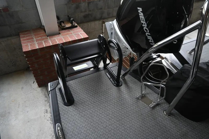 Slide: The Image of The image shows the rear of a boat with a ladder and motor. The flooring has a textured pattern. - 16